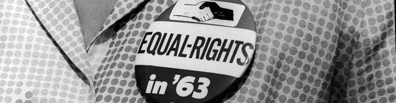 Civil Rights Rally Button A women wears an equal-rights button during the March on Washington in 1963