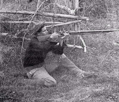 Pvt. William W. Grayson in firing position on the spot where he fired ...