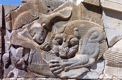 Ancient carving of Angra Mainyu devouring a bull.