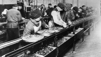 Assembly line workers, building wheels
