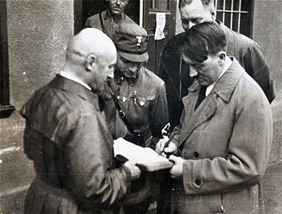 Hitler signed a piece of paper proclaiming peace 