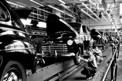 Workers in the assembly line, responsible for putting tires on cars.