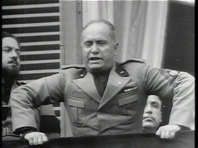 Mussolini giving a speech on a balcony, circa 1930 https://www.bing.com ...