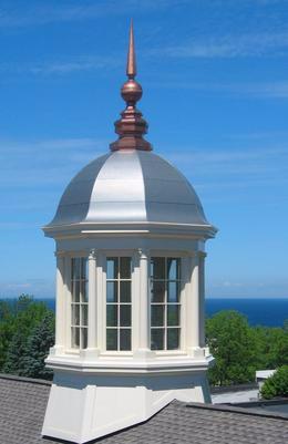 Cupola: A small dome that sits atop of a cylinder, adorning a roof.