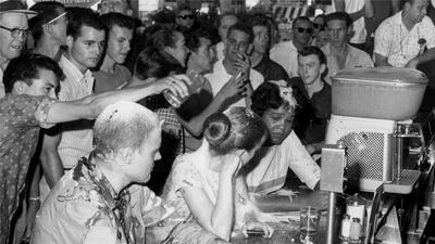 A group attacked, but kept protesting segregation without violence.