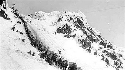 This a picture of many miners going up the hill in search of gold.