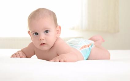 Infants at 0-3 months old position themselves to lift their heads-- the ...
