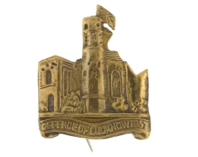 Cap badge 1933-1947.Ruined residency at Lucknow above a scroll ...