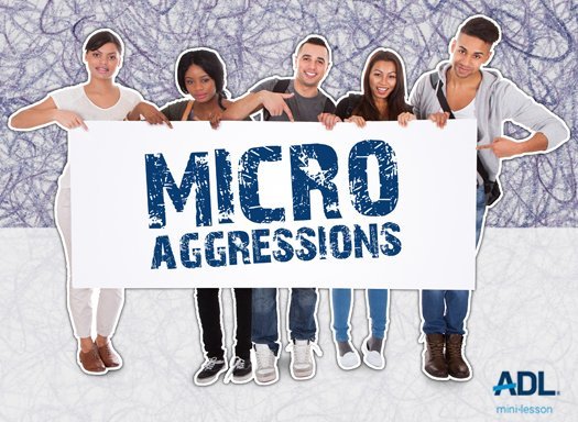 Image Of Young People Holding Up A Sign That Reads "Microaggressions".